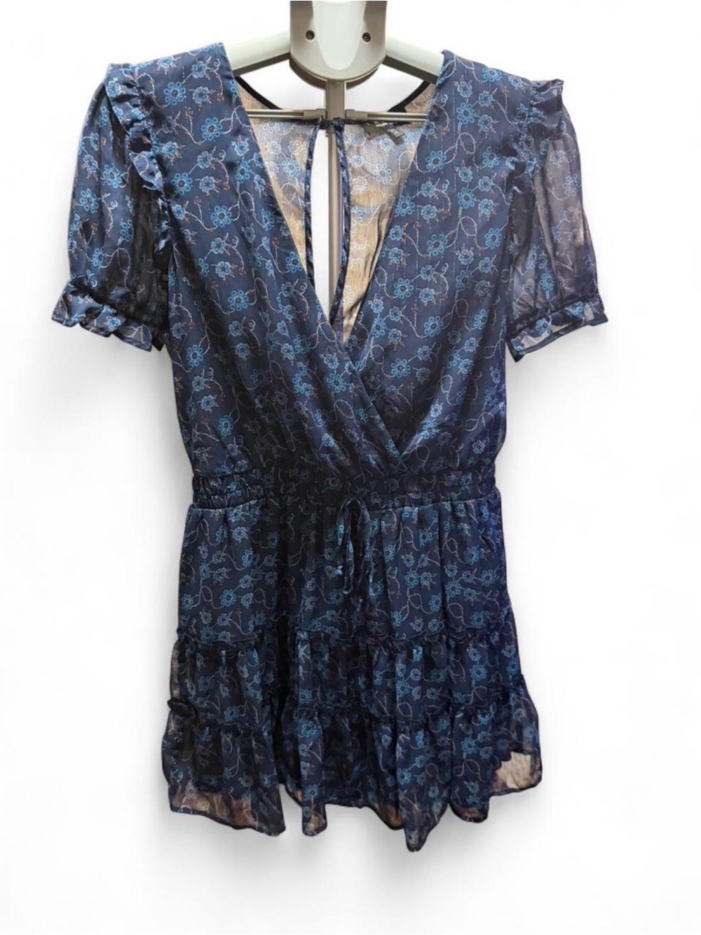 the clothing company Navy Blue Floral Ruffle Wrap Dress